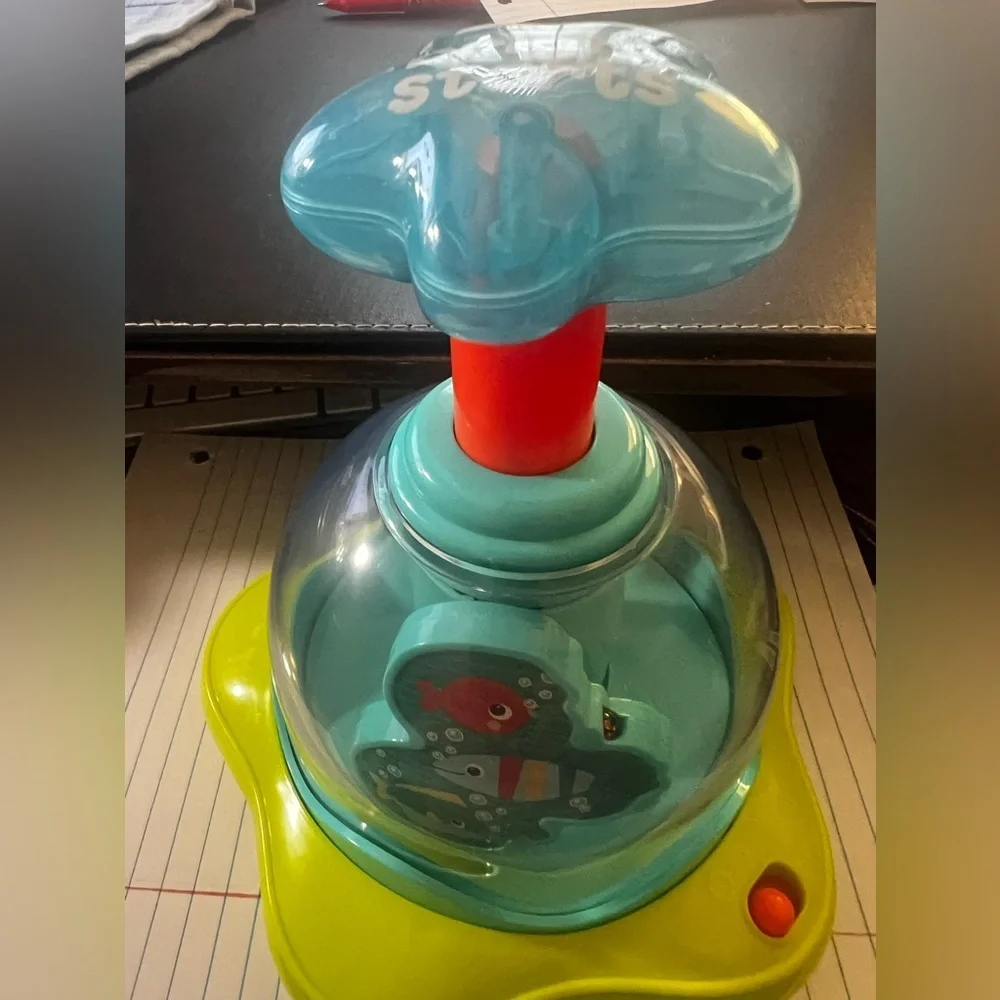 BRIGHT STARS PRESS AND GLOW SPINNER.  EVERY PUSH MAKES THE STARS GLOW